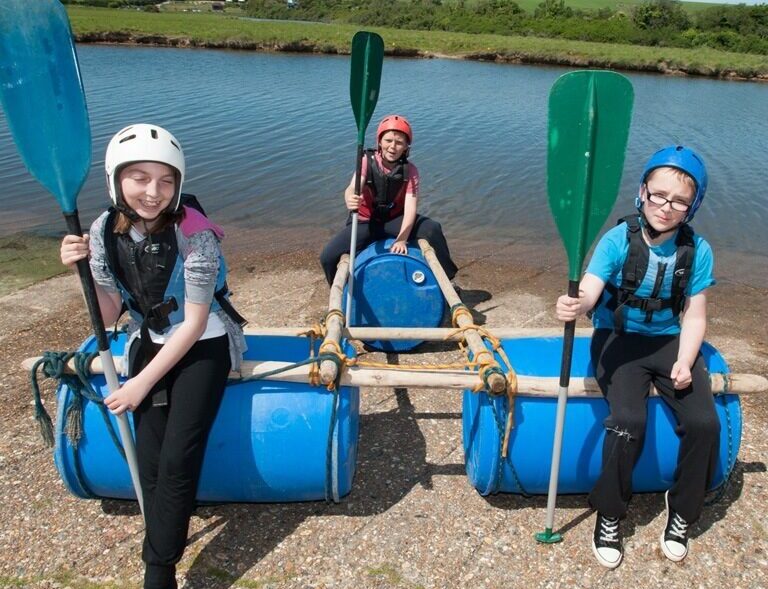 Kids aboard their raft