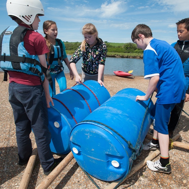 Kids building a raft