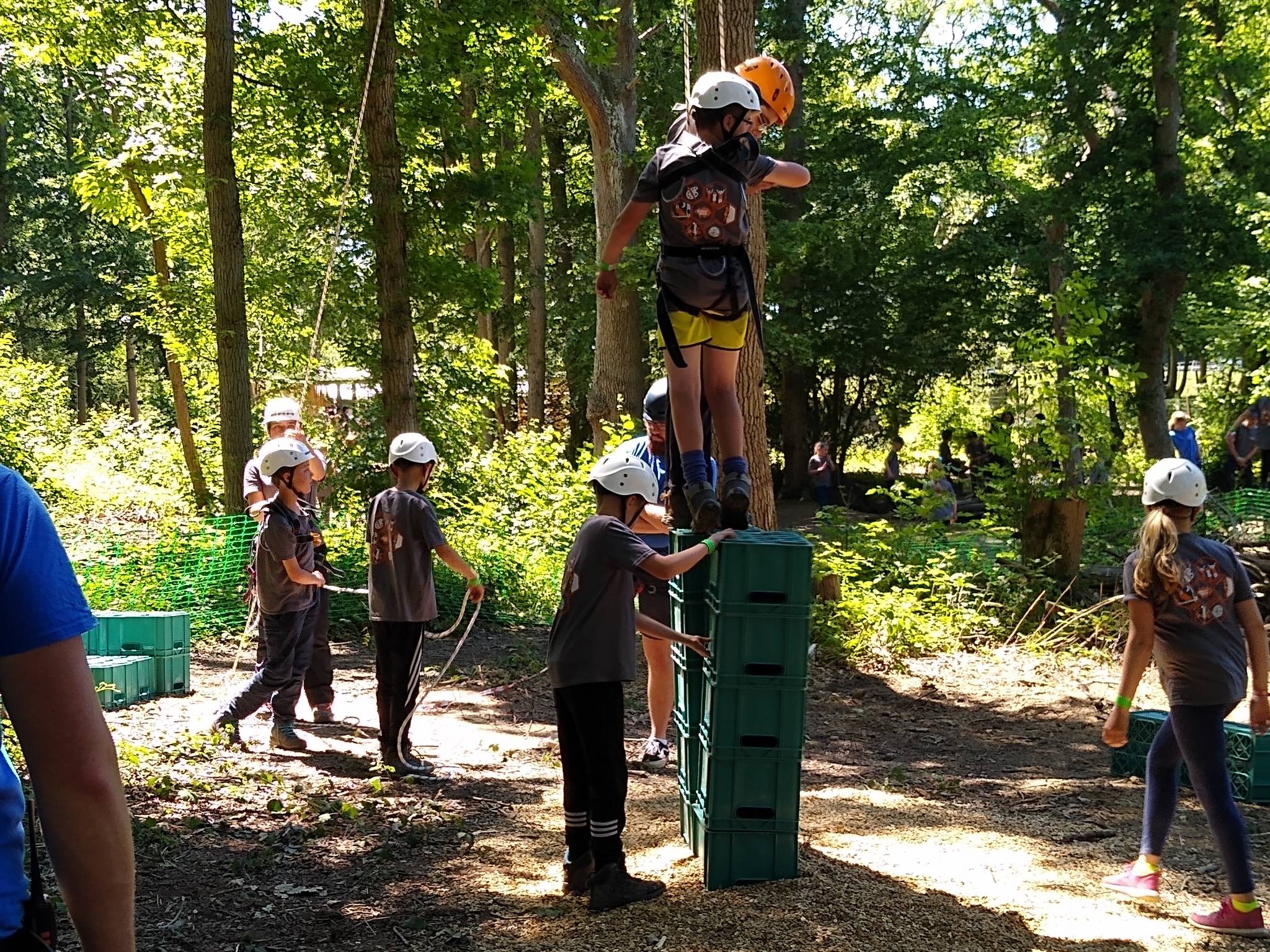 group of children participating in crate stacking challenge